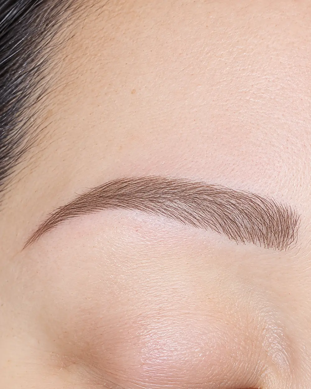 Close up of one client's brow after brow work.