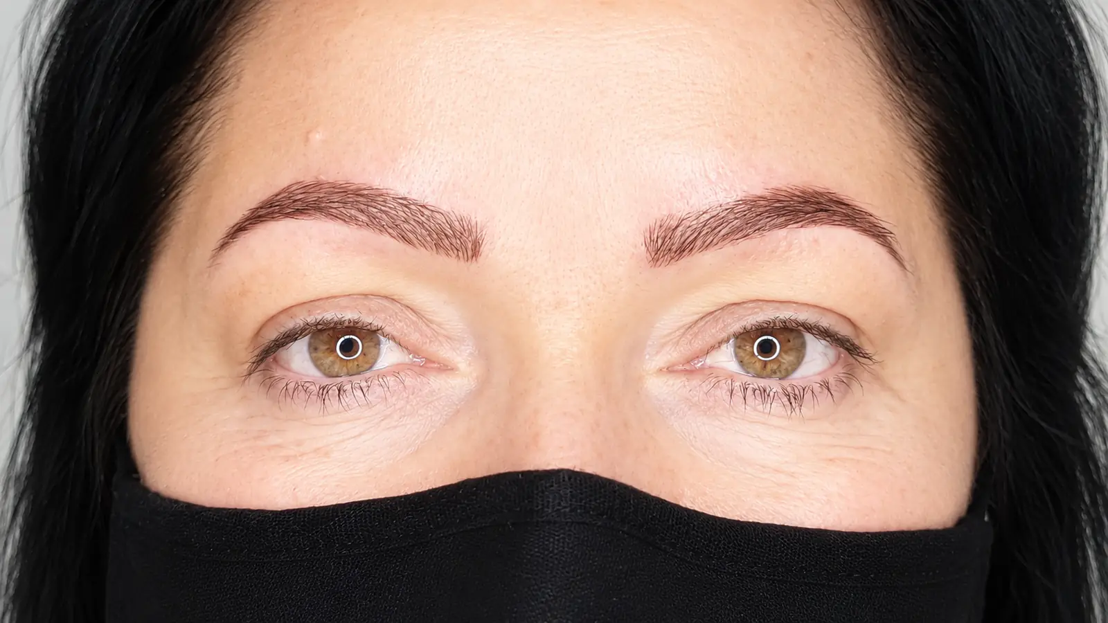 A client's brows photographed straight on after brow work at Le Beauty Secrets.